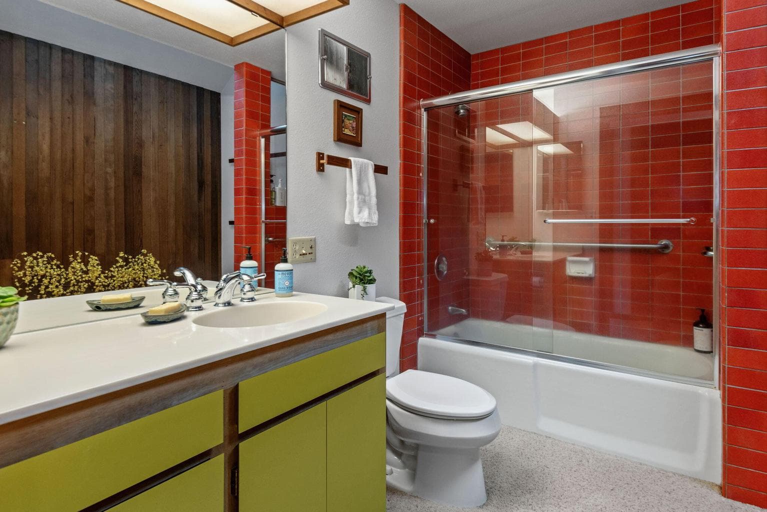 Downstairs guest bath - love the red tile!