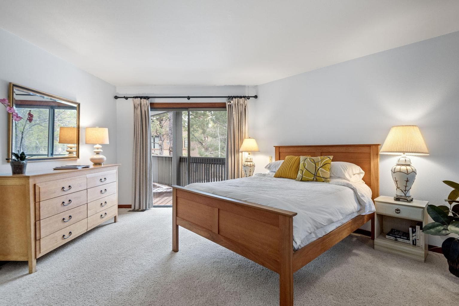 Primary bedroom upstairs with it's own private deck.