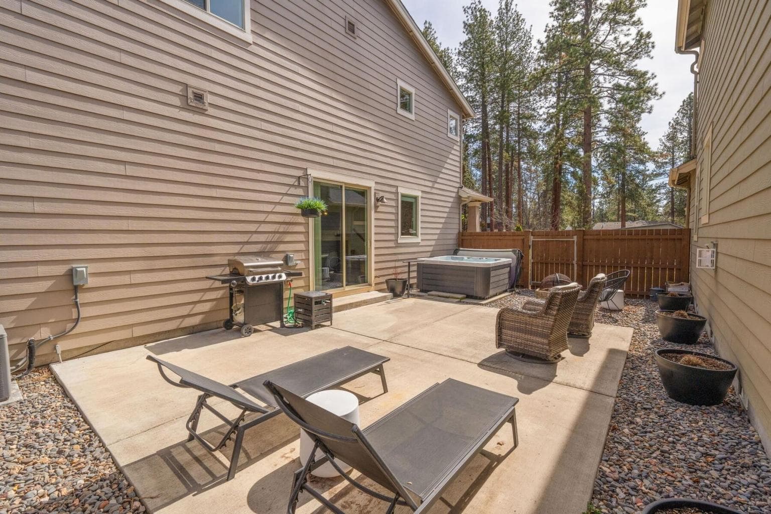 Expansive Patio: Perfect for entertaining, complete with flower pots and BBQ gas line for outdoor cooking.