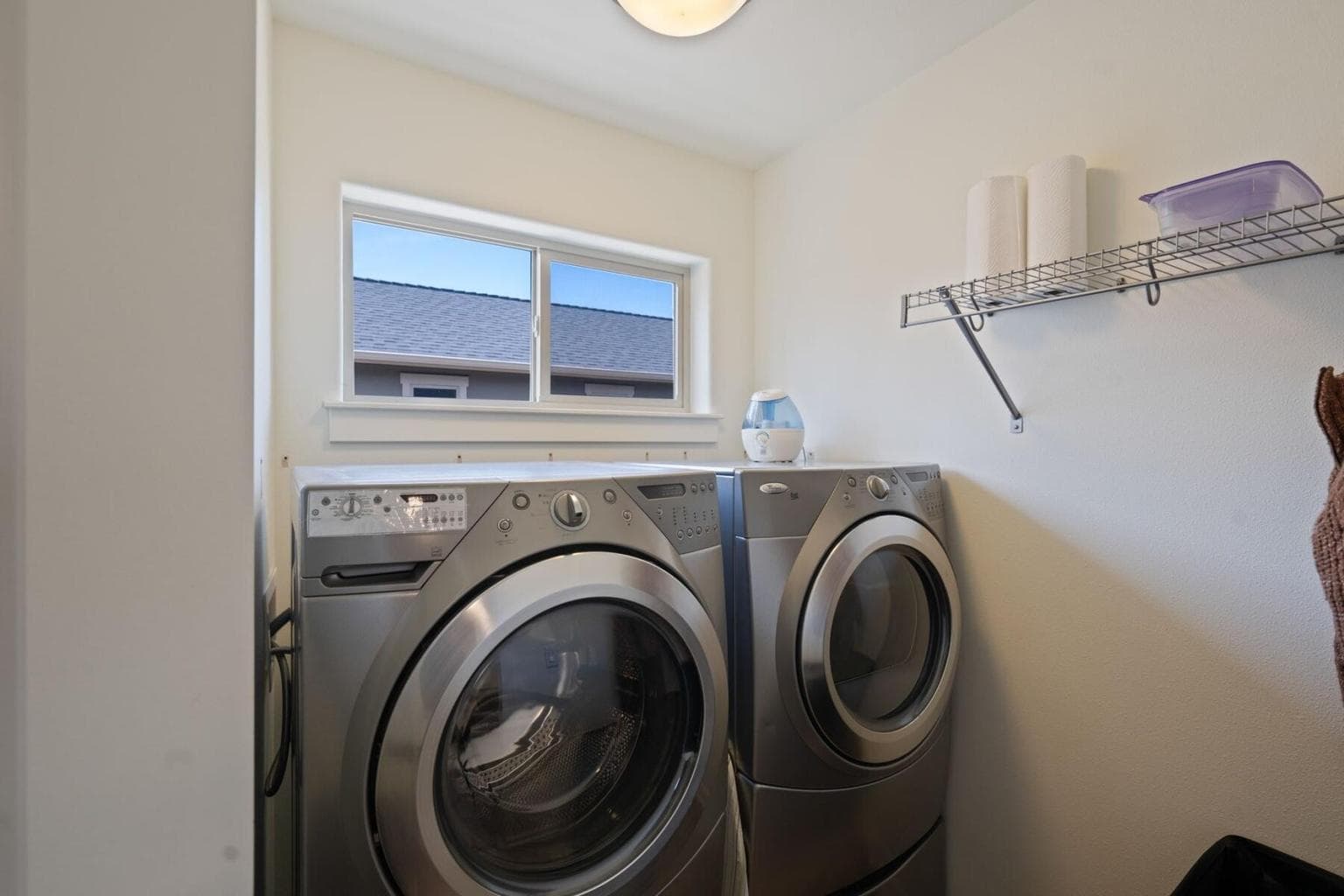 Upstairs Laundry: Conveniently located laundry room on the upper level for ease of use.
