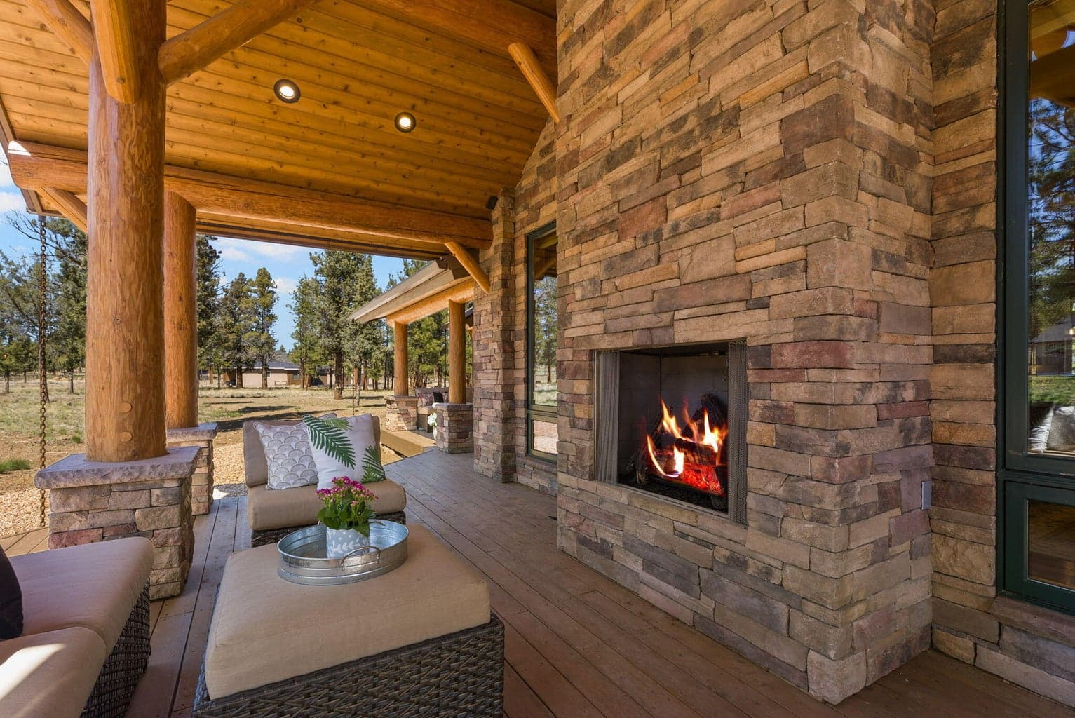 Covered outdoor living area off the great room features propane fireplace, propane BBQ, and more.