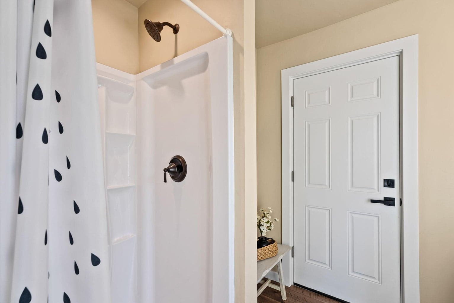 Flex space off the garage has full bath, storage closet, and potential for future kitchenette.
