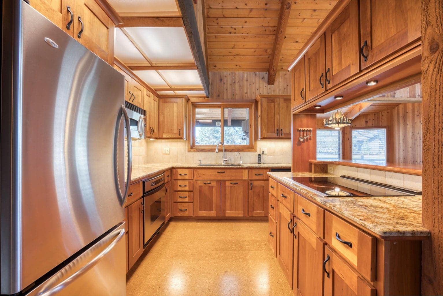 Cork floors and beautiful wood cabinets.