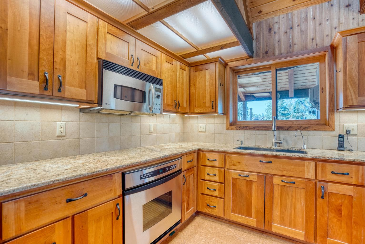 Direct and indirect lighting enhances the kitchen.