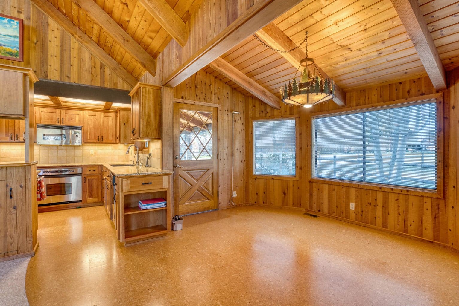 Cork floors and access to rear covered porch.