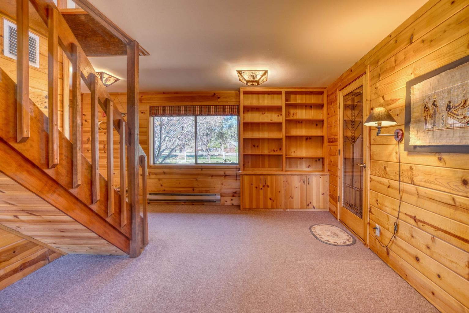 Wood paneling and built-in bookshelves.
