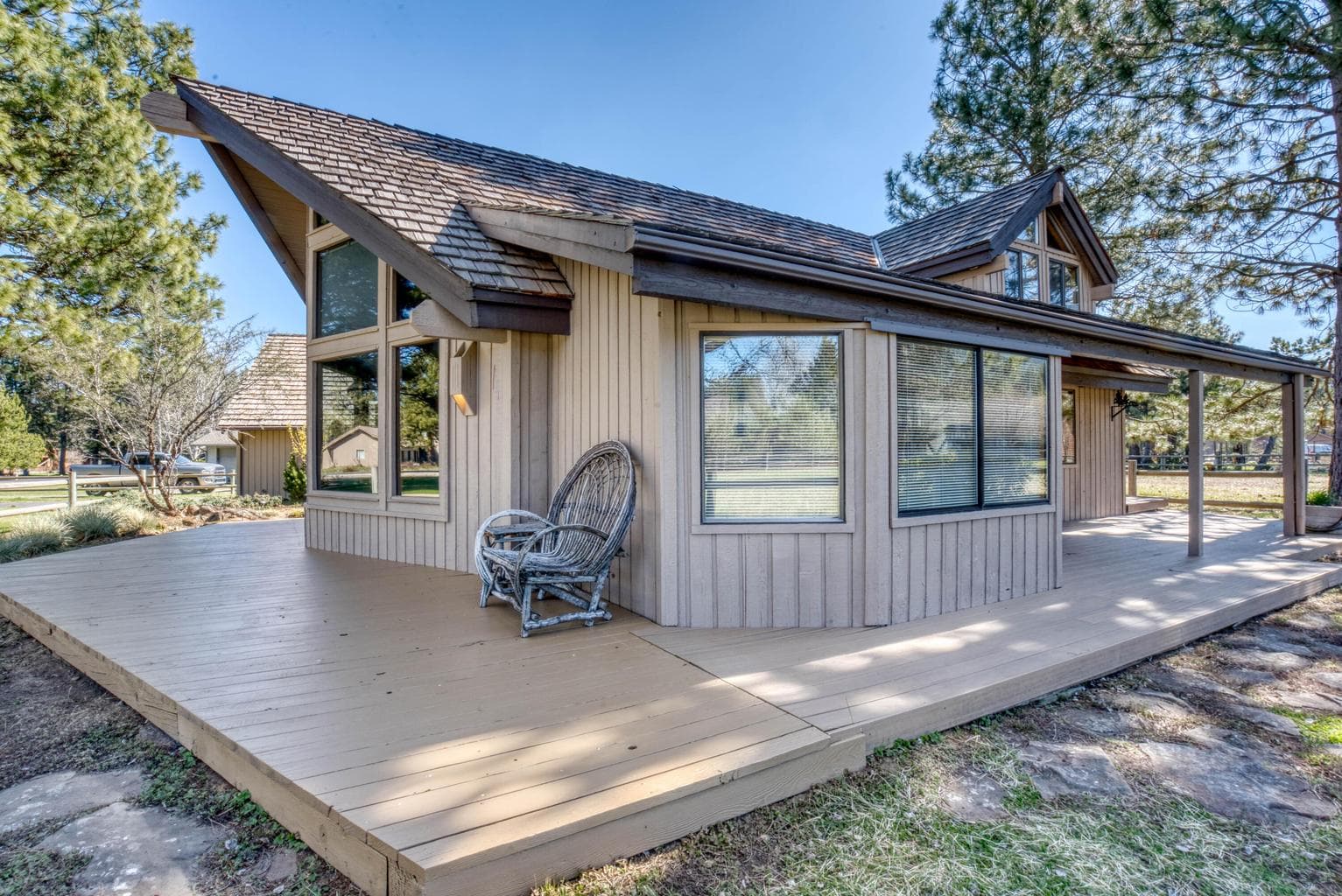 A large deck on 3 sides of the home.