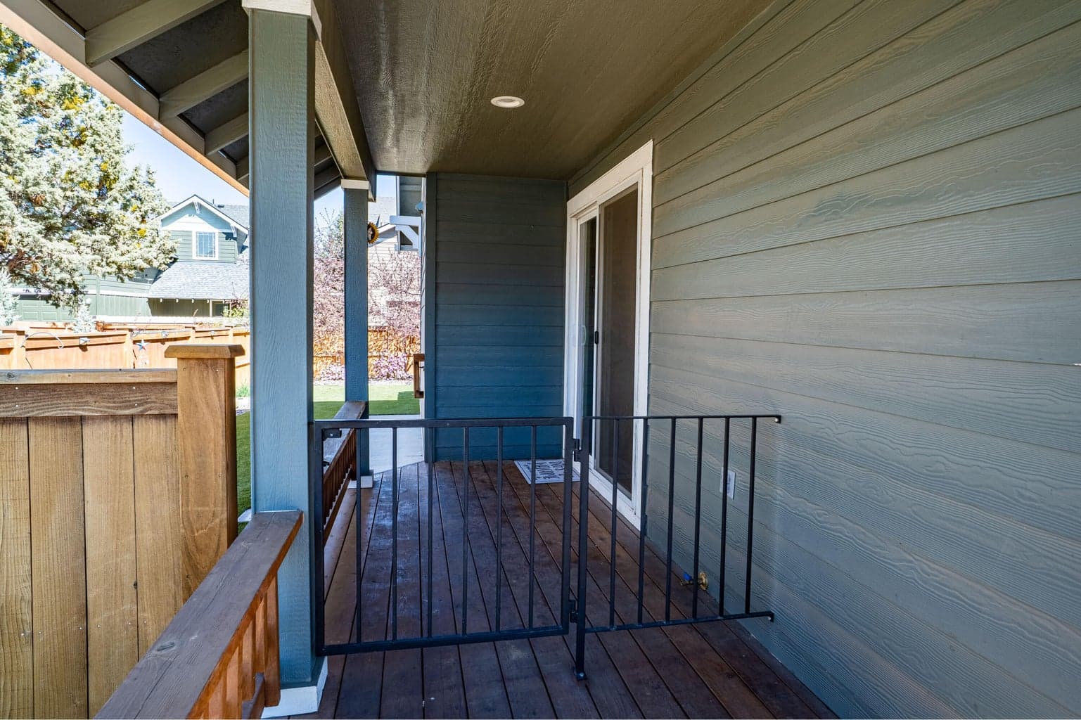 Gated side porch to keep the pups/kids in the yard