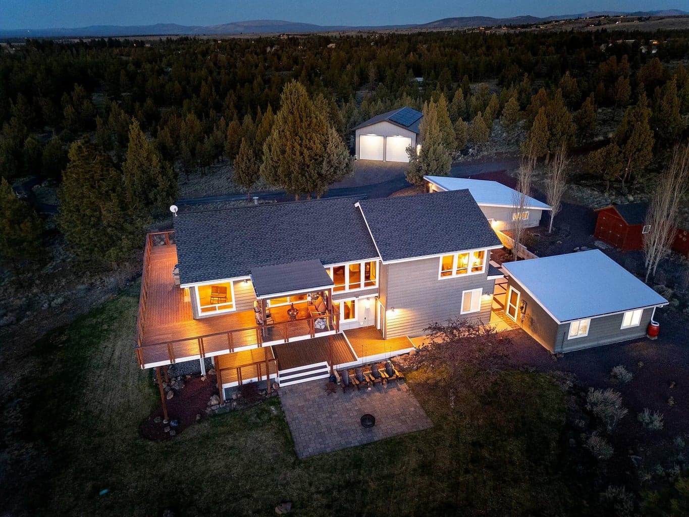 Serene landscaping and luxury design harmonize with the natural setting.
