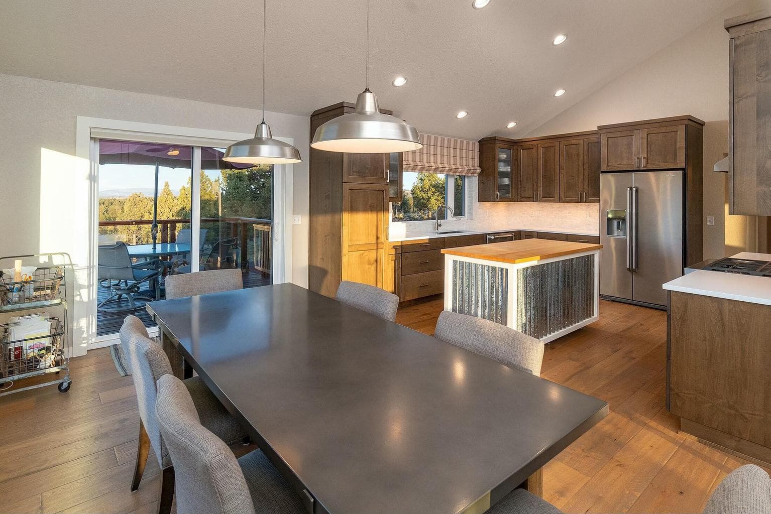 Easily transition to alfresco dining with direct deck access and panoramic views.
