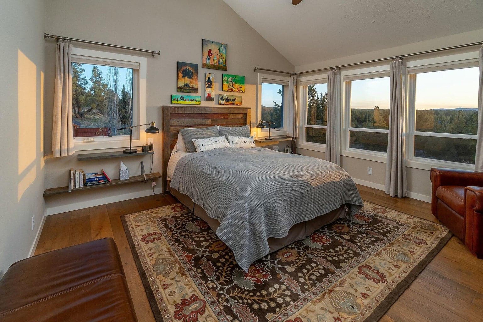 Sunlit main-floor retreat with wall-to-wall windows overlooking serene landscapes.