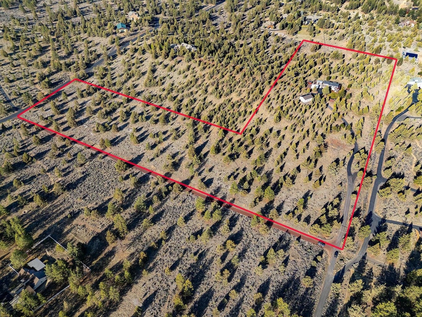 Private and secluded 19.7-acre estate with a meandering driveway, creating a grand approach and ultimate sense of privacy, perfectly framing the surrounding mountain vistas.
