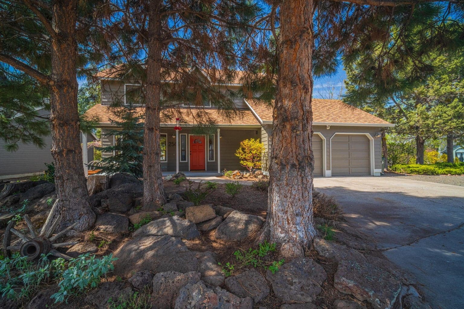 Tranquility meets convenience on this spacious lot with mature trees and landscaping