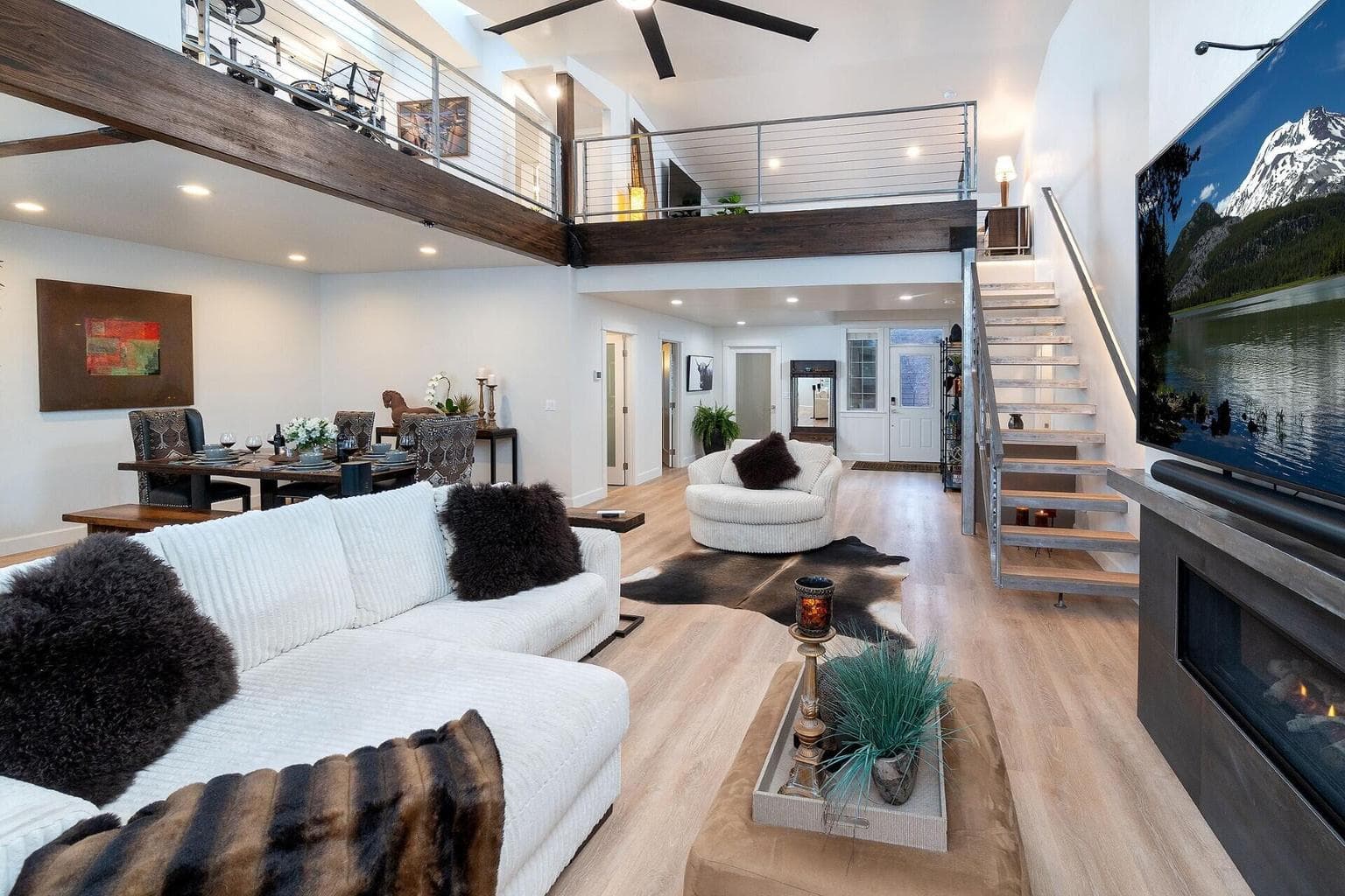 Great Room open floor plan adjoins kitchen, dining, and outdoor living space.