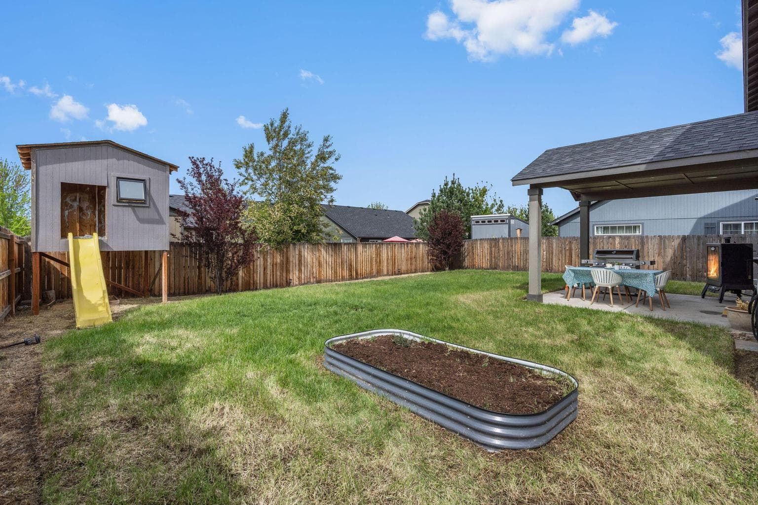 Big fenced yard with play structure
