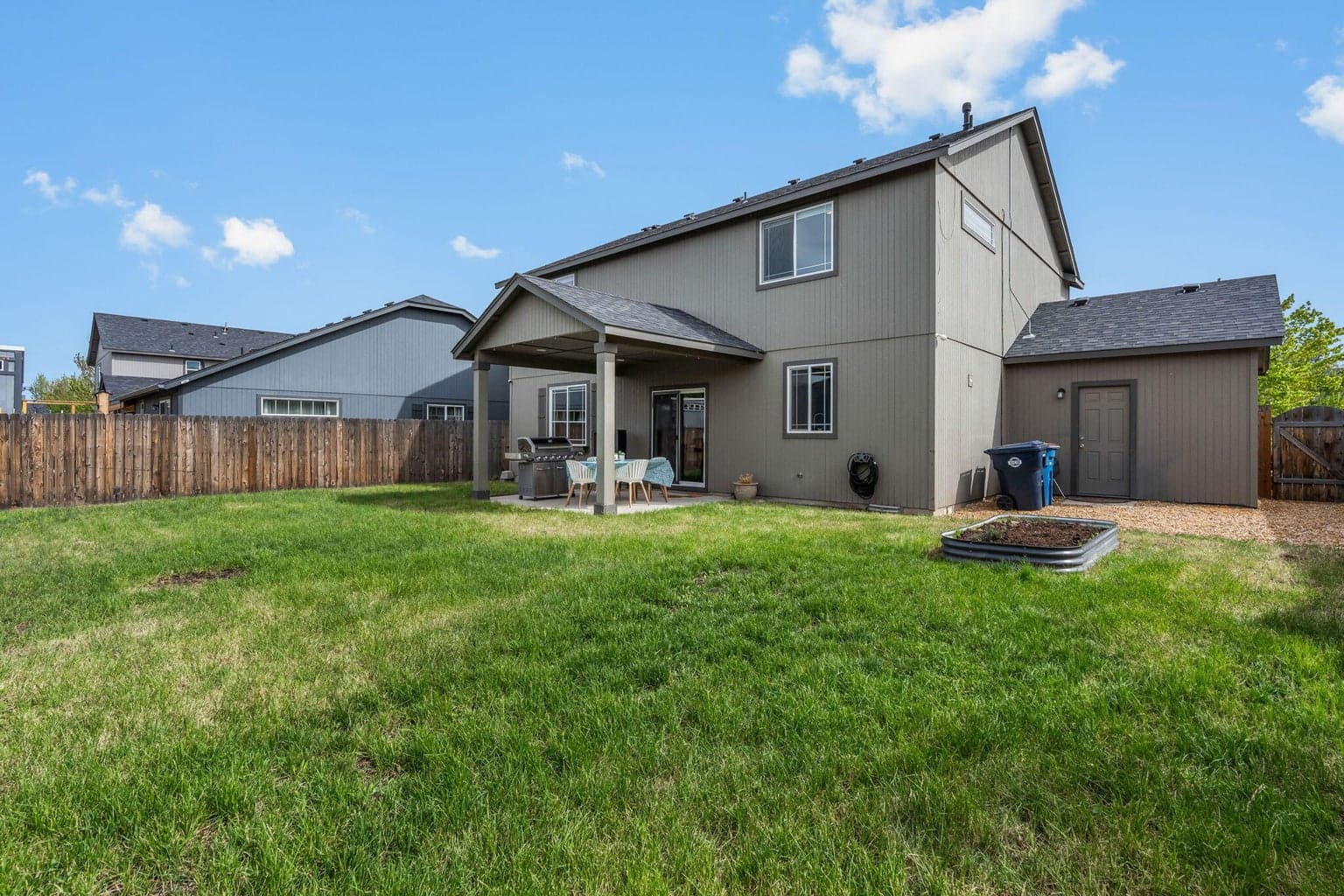 Side yard with door into garage