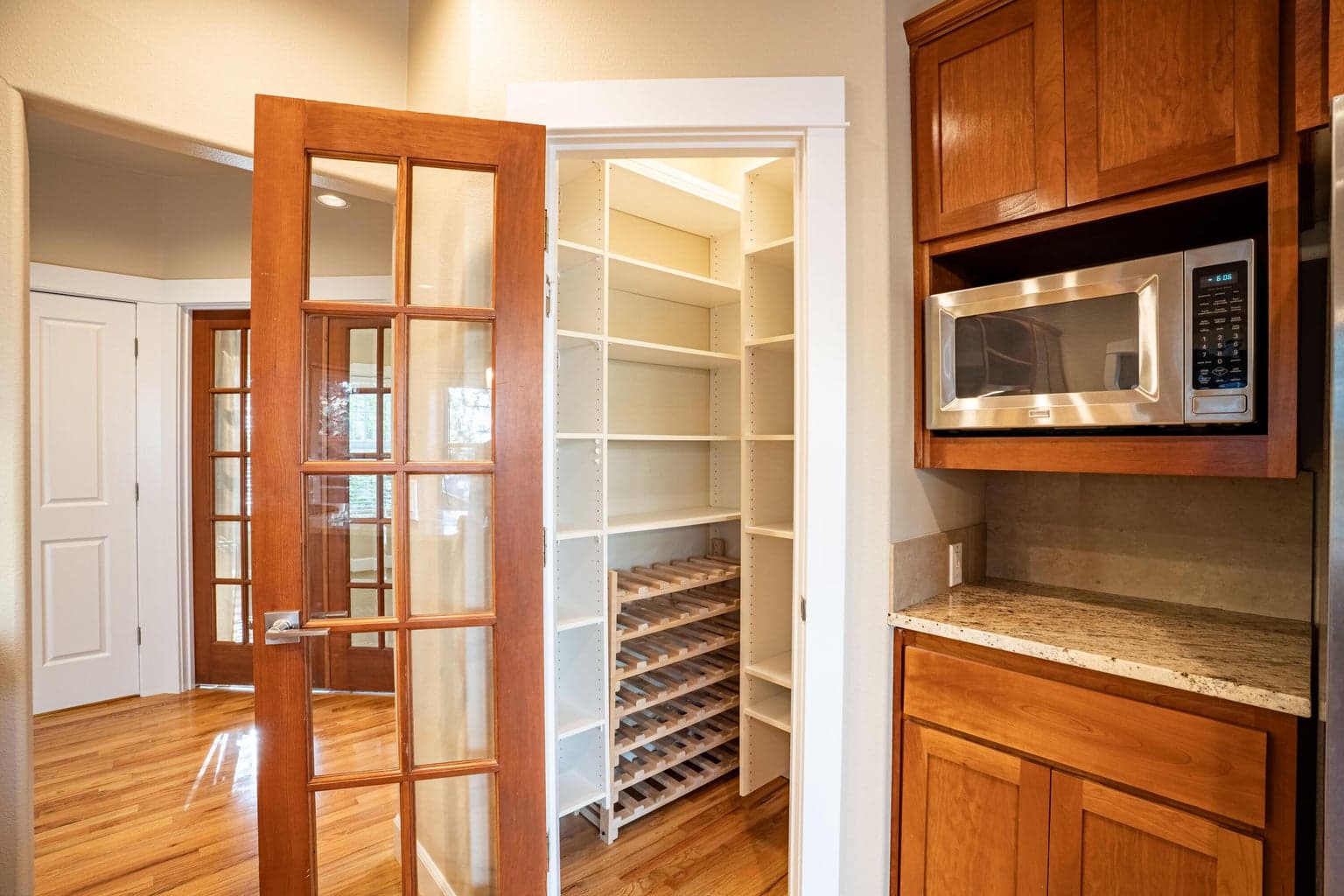 Large pantry with great shelving and wine rack