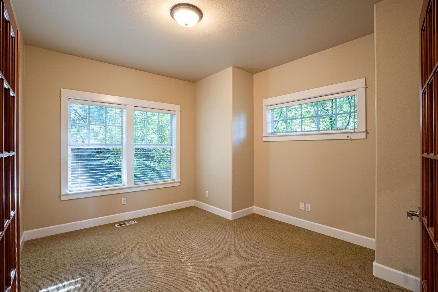 French doors open into the main level office