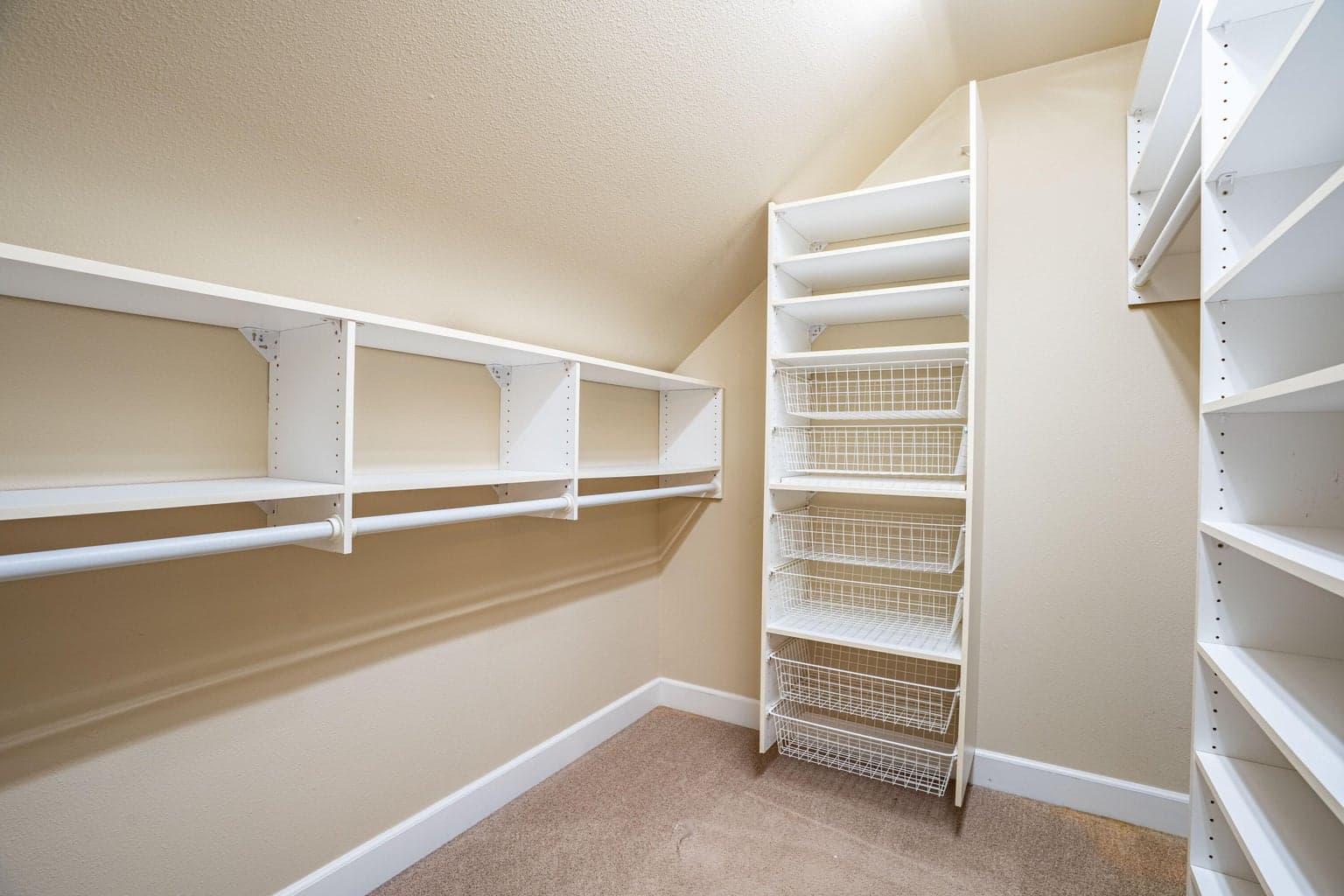 Primary walk in closet with packs