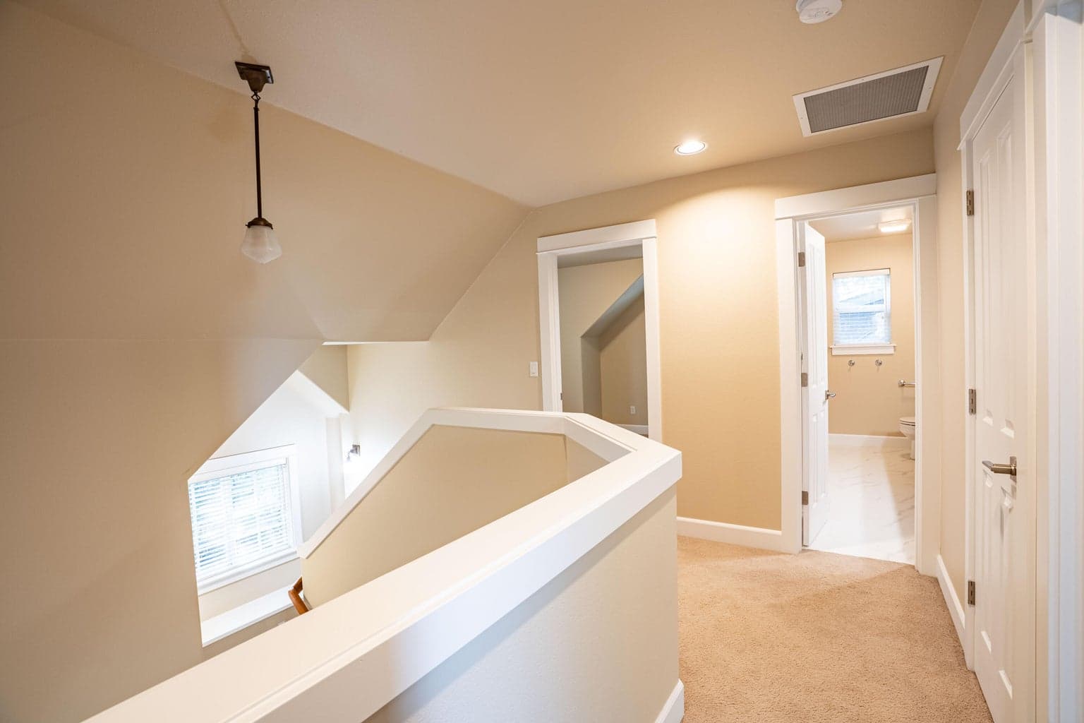 Upstairs landing showing one guest room, guest bath and linen closet