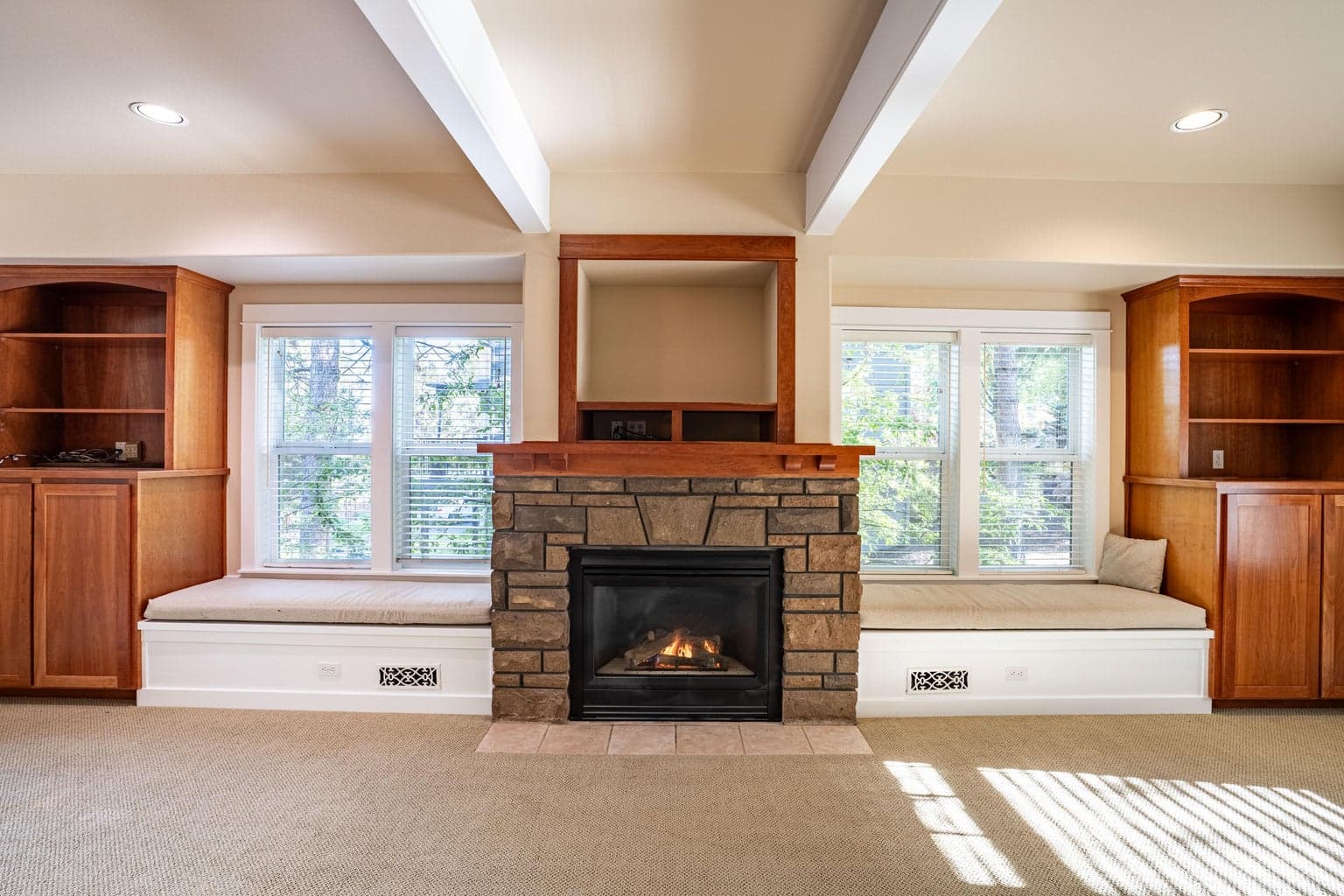 Built in storage and benches bookend the natural gas fireplace.