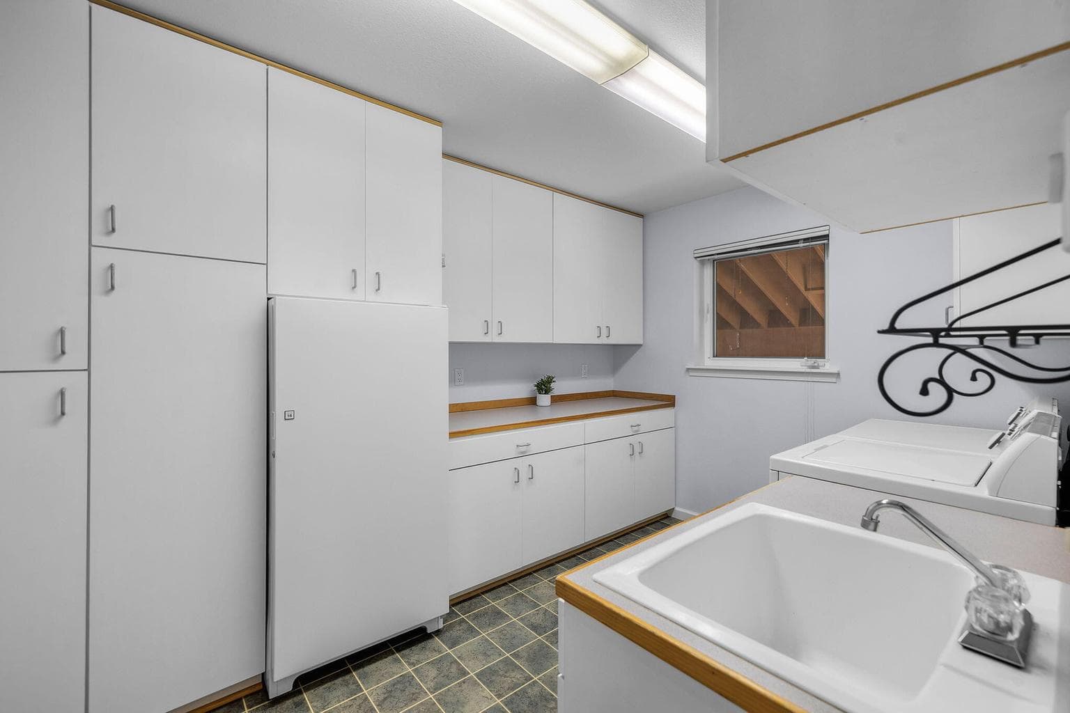 Large laundry room and storage downstairs.