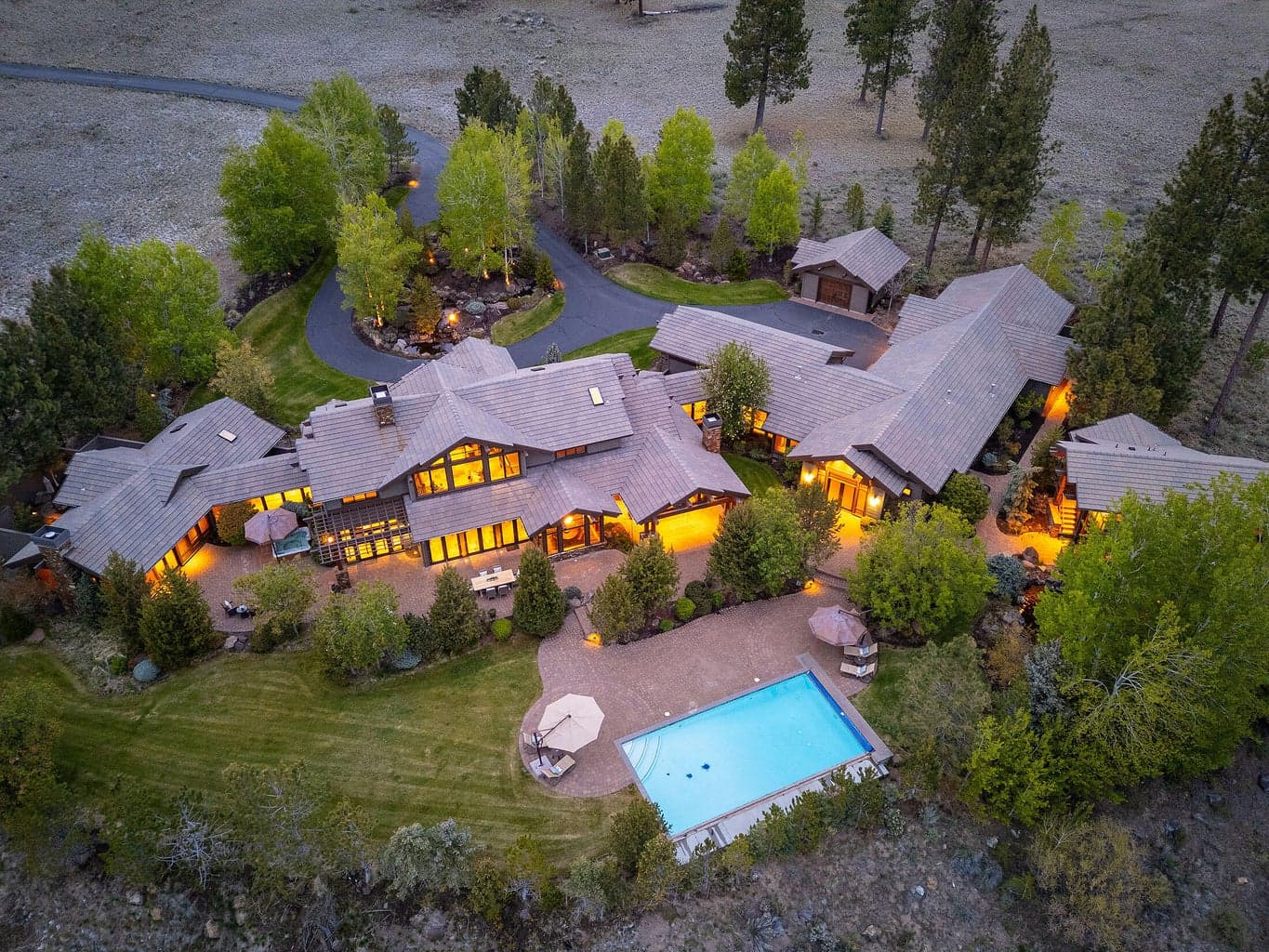 An elevated view of pure serenity—10.9 private acres with resort-style pool, guest house, and sweeping mountain scenery in the exclusive Highlands at Broken Top.