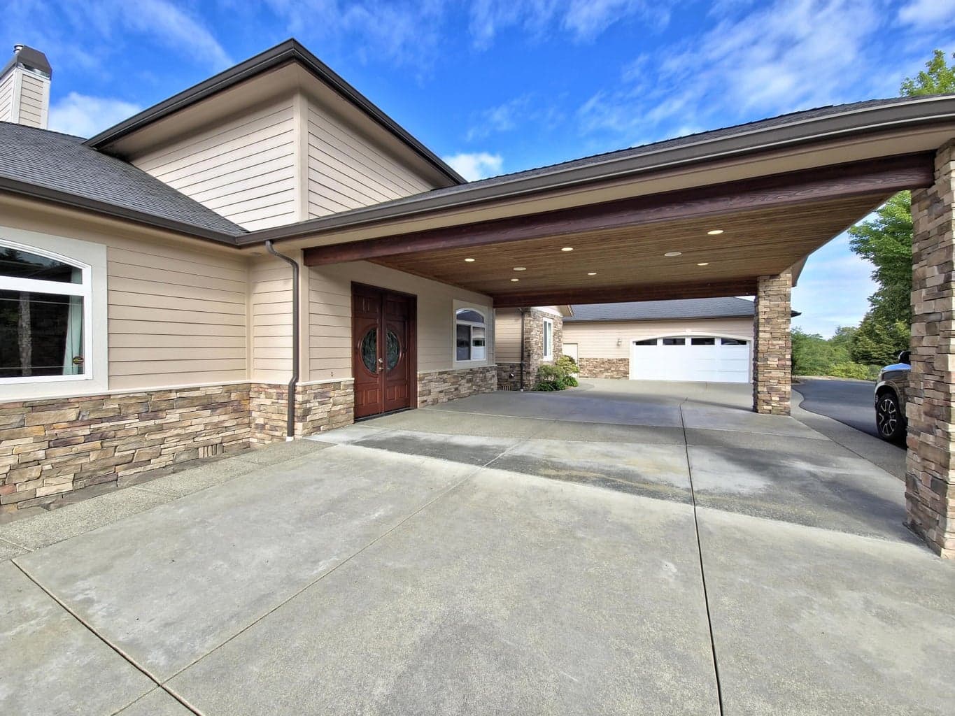 Porte cochere to the french door entry