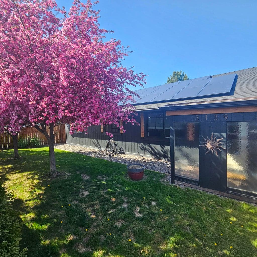 The fully fenced Front Yard offers mature landscaping and seasonal color.