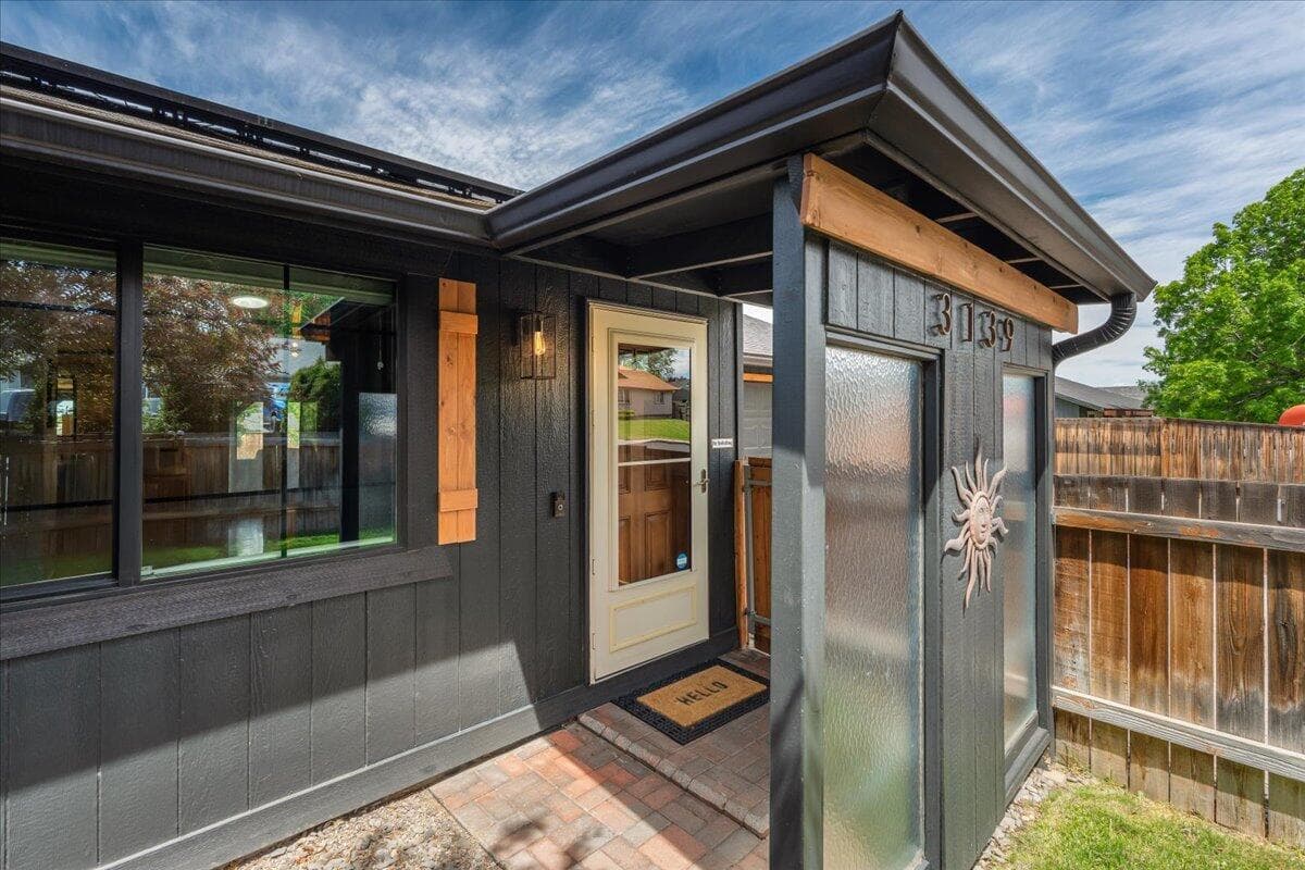Covered entry way with partial screening to keep the weather out!