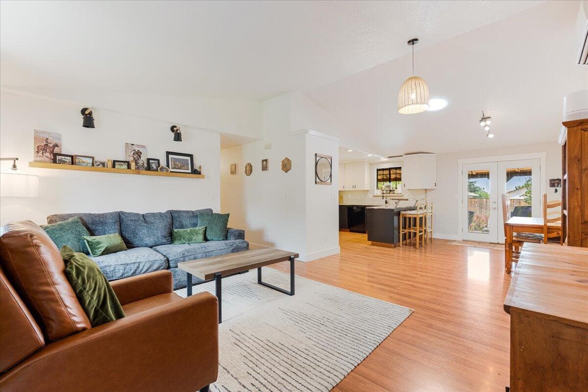 Inside, an open concept plan offers a lwelcoming interior with vaulted ceiling and abundant natural light.