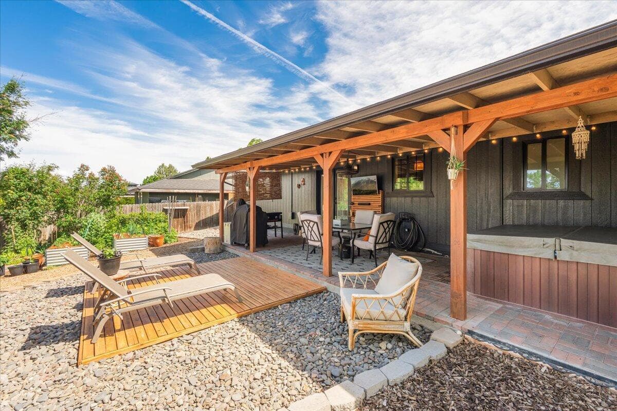 Covered rear patio and sun deck.