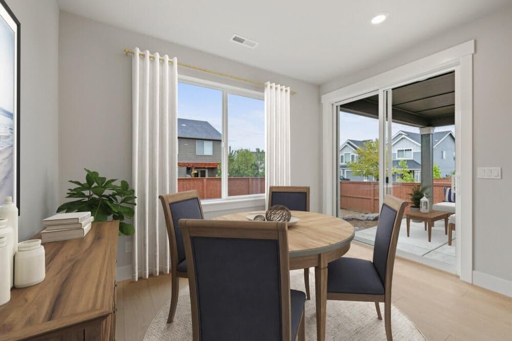 Virtual staging, subject property - dining area that accesses the large covered patio that has upgraded rear yard landscaping!