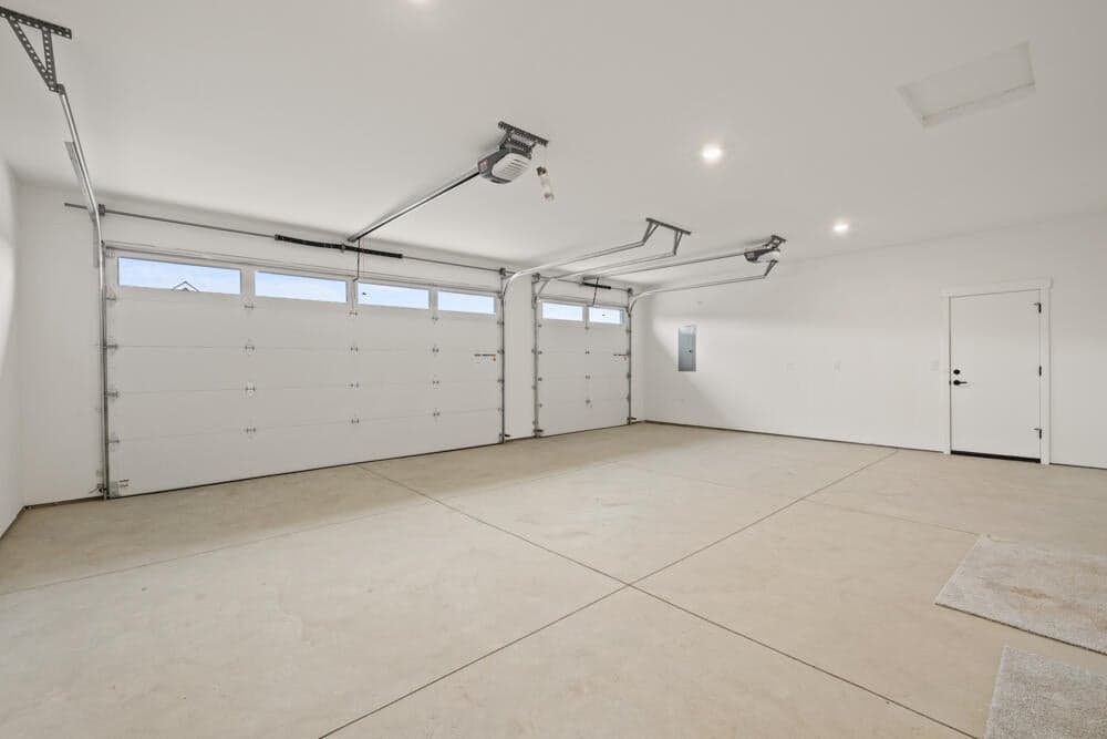 Virtual staging, subject property. Roomy 3-car garage has a man door to the side yard.