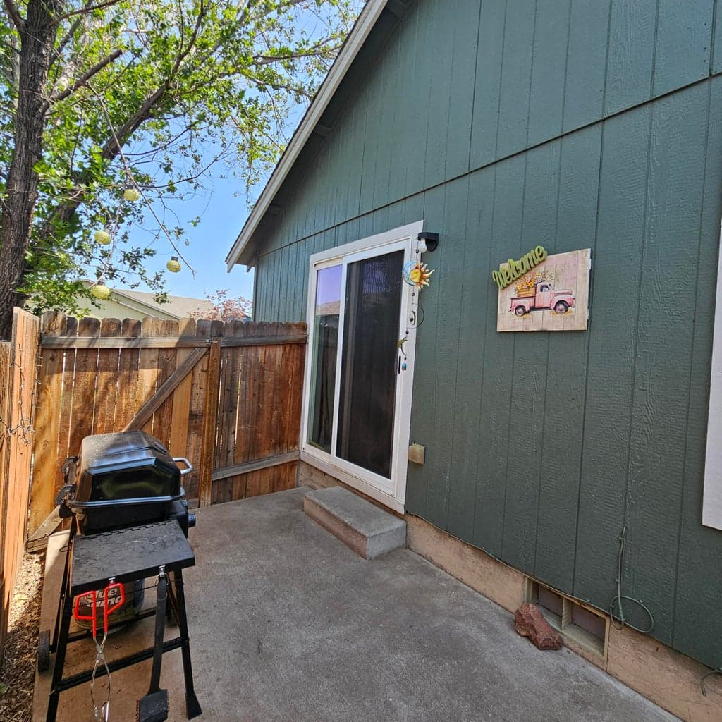Side Patio off Great Room is great for BBQ and evening shade.