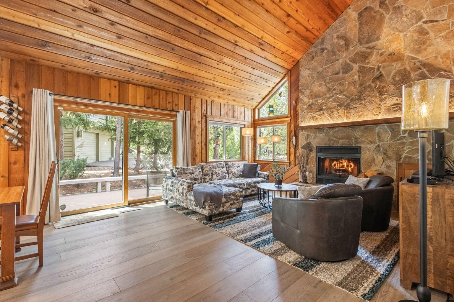 Vaulted Living Room with Floor to Ceiling Stone Fireplace