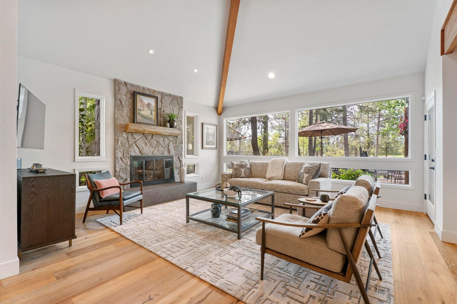The great room features vaulted ceilings, gas fireplace and golf course views.