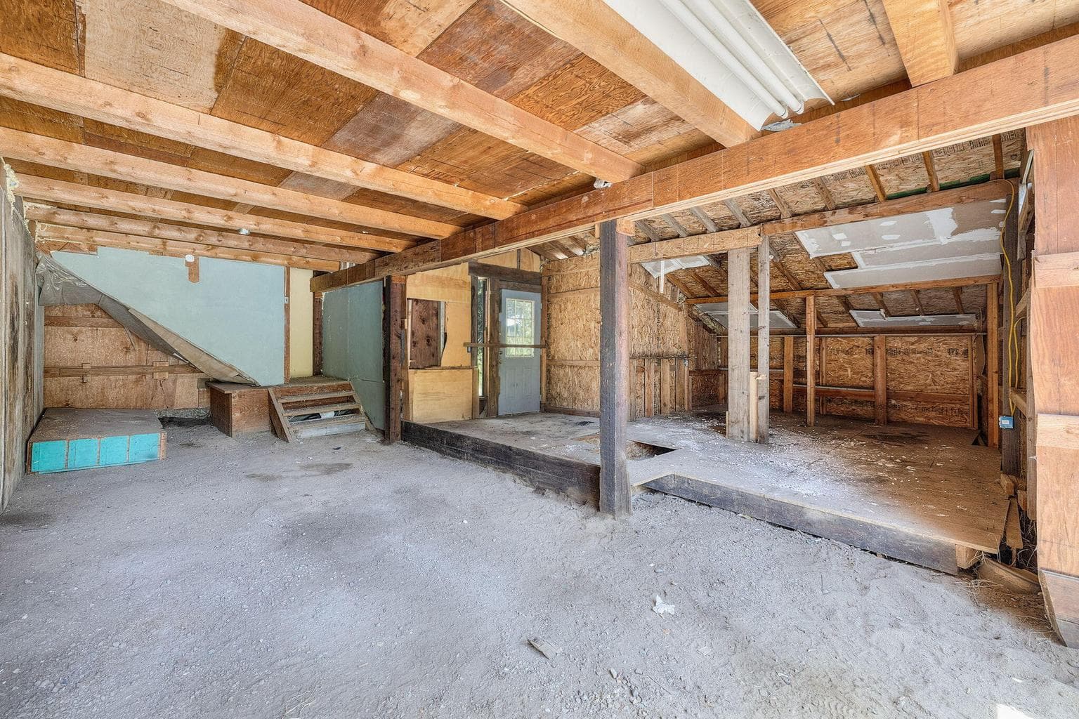 first shop with large doors, and upstairs area