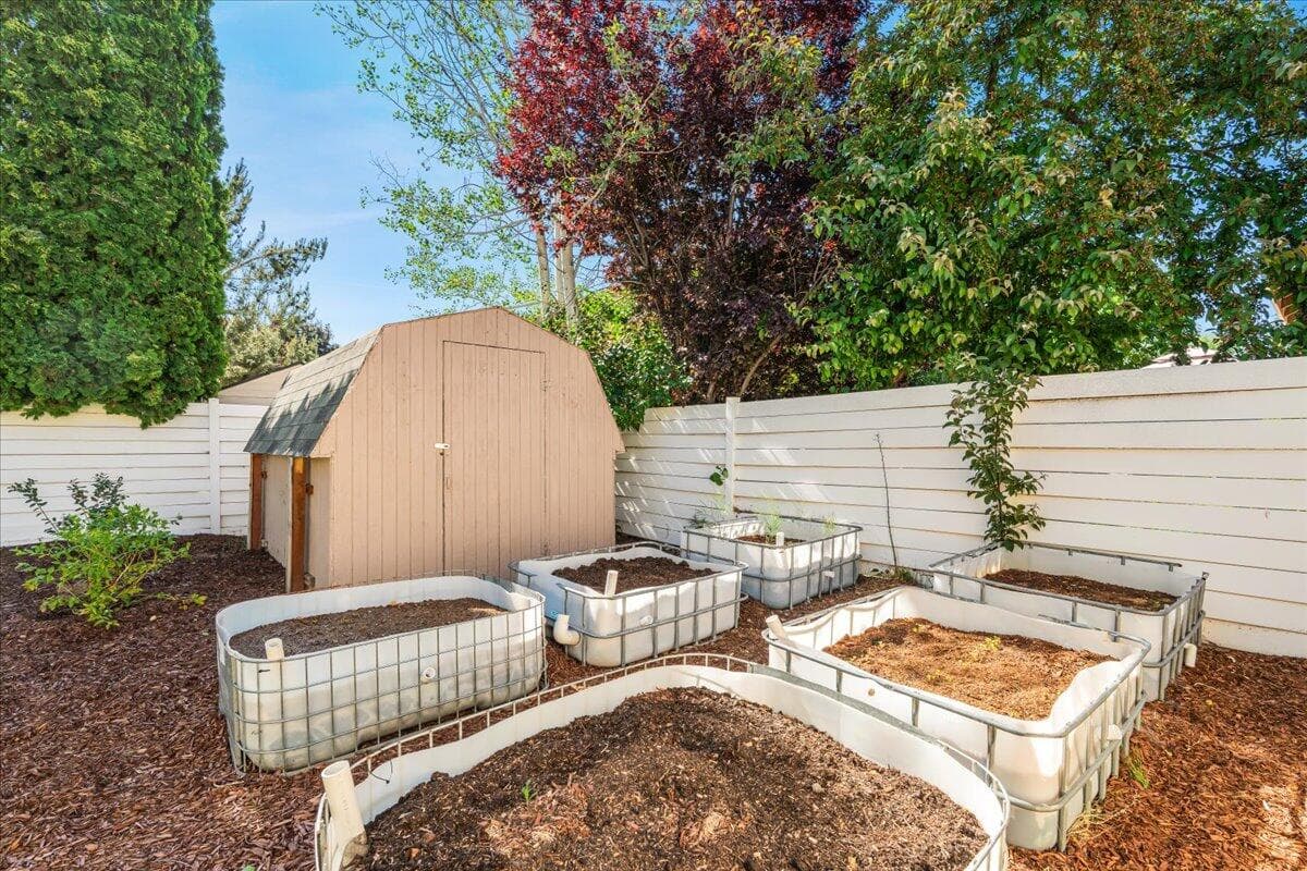 raised beds already planted with vegetables and fruit.