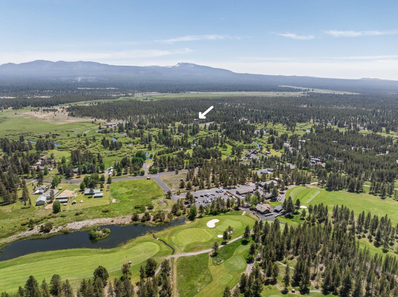 Aerial view from above Quail Run Golf Course captures the home’s unbeatable proximity to one of the area's premier golf destinations.