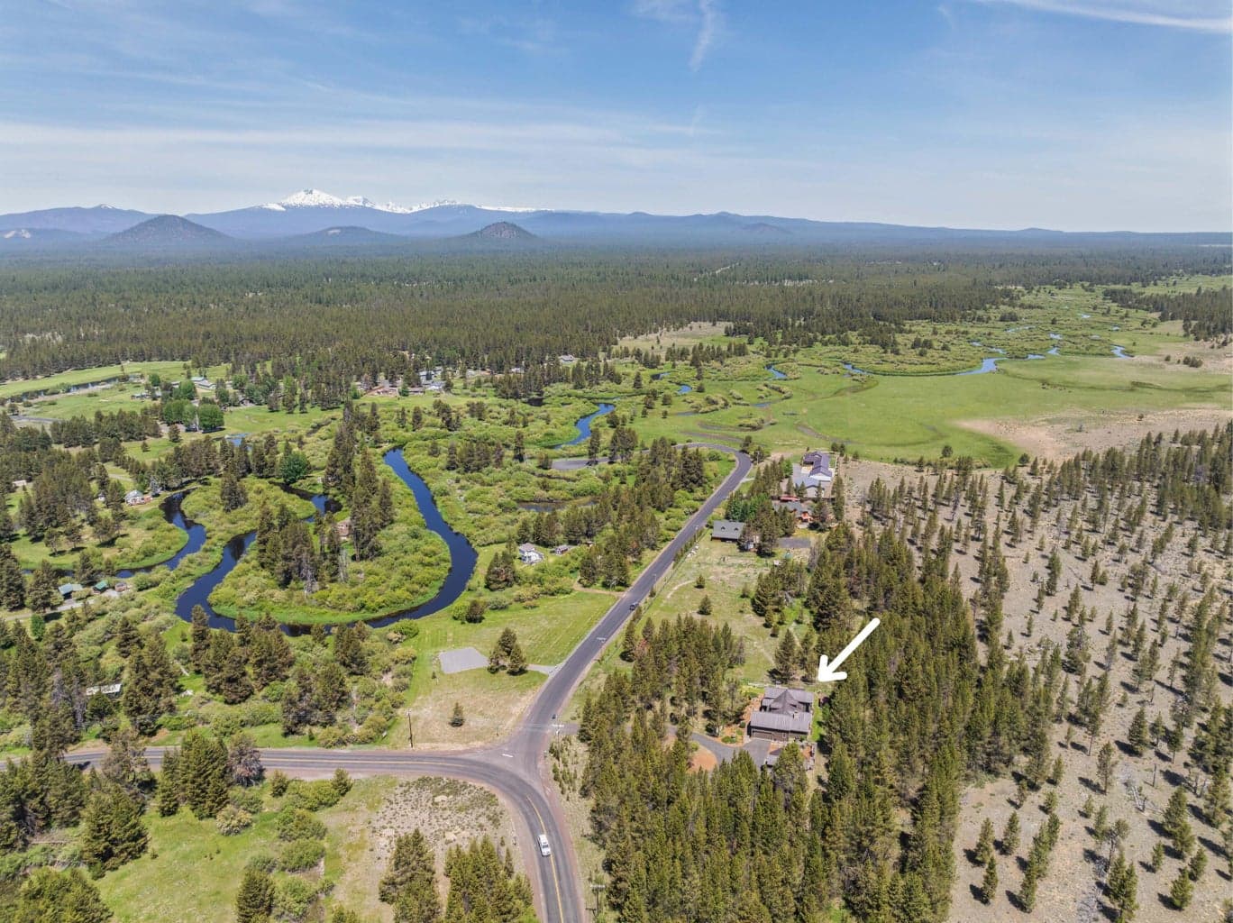 Aerial view looking north toward Sunriver highlights the property’s ideal location and scenic surroundings.