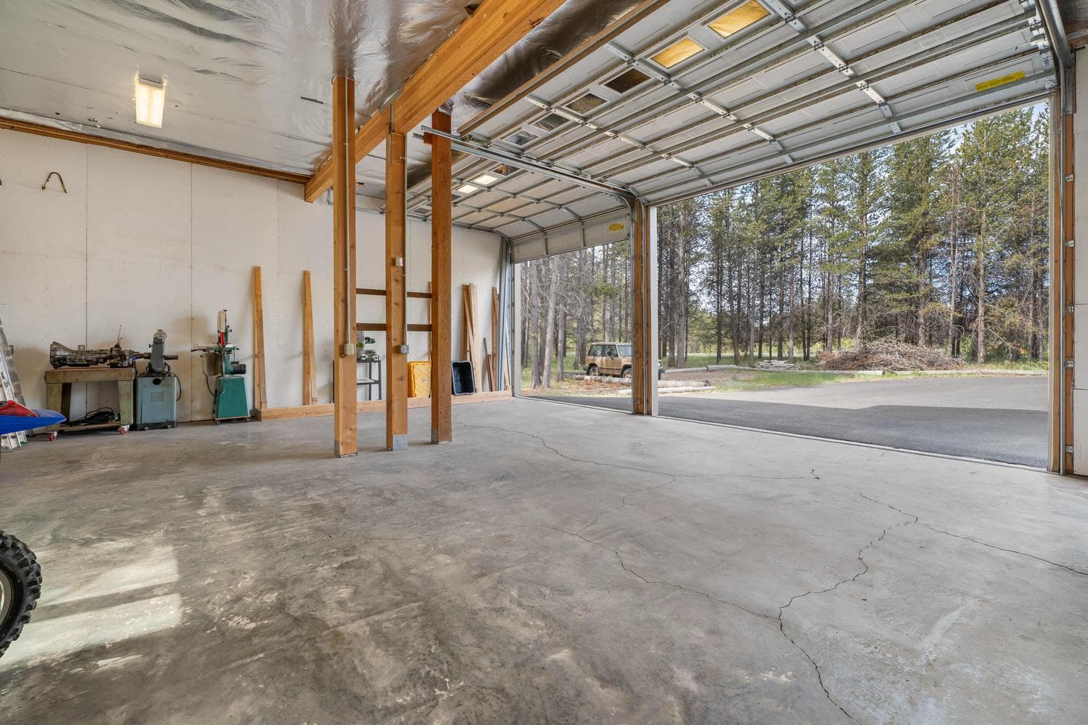 Throw open your garage doors to peaceful forest views—where nature becomes part of your everyday backdrop.