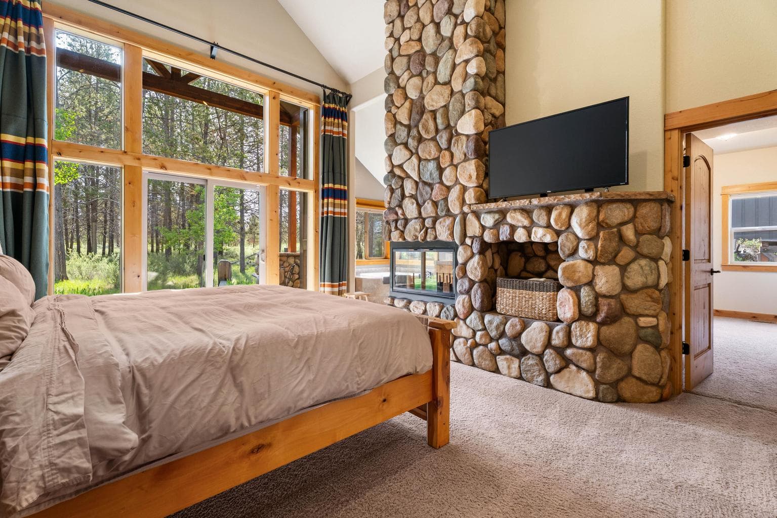 A cozy corner view of the primary suite, showcasing its spacious layout and serene ambiance.