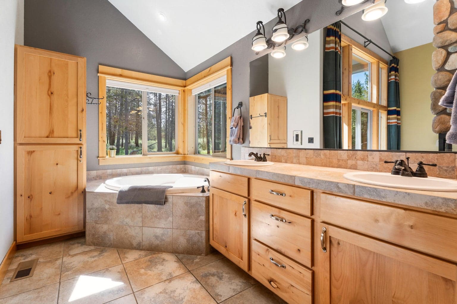 Dual kitchen sinks and abundant storage make meal prep and cleanup a breeze—function meets style in this thoughtfully designed space.