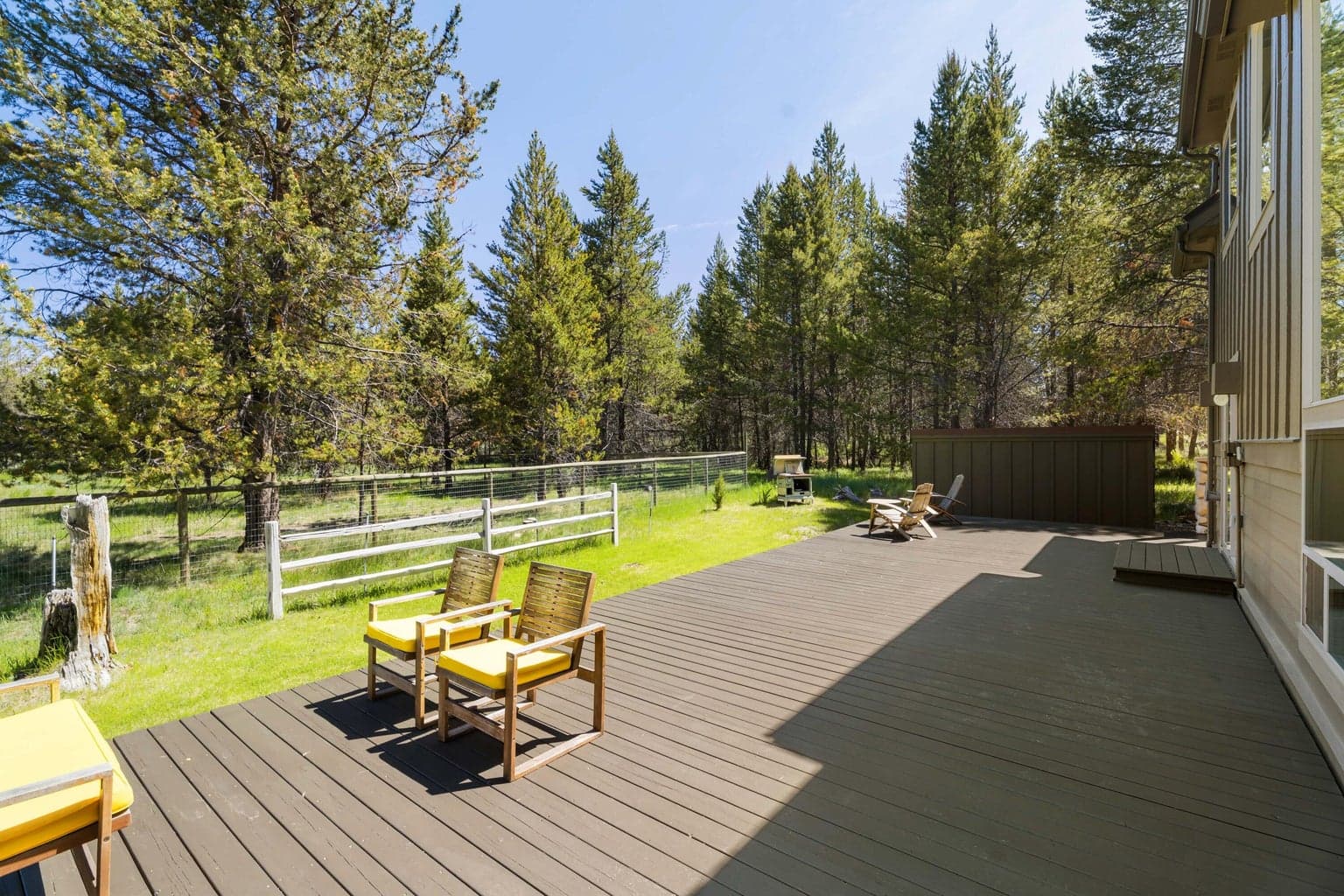 Enjoy outdoor living on the expansive, newly refinished deck—perfect for entertaining, dining, or simply soaking in the surroundings.