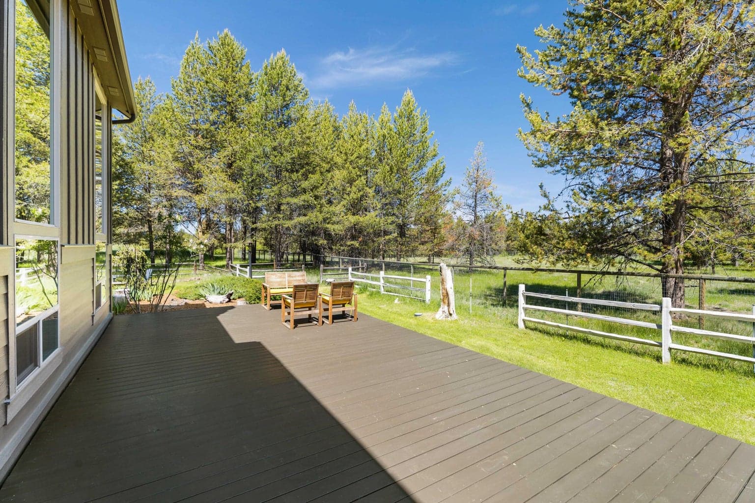 Spacious wraparound deck offers endless possibilities for outdoor living—plenty of room for lounging, dining, and custom design touches.