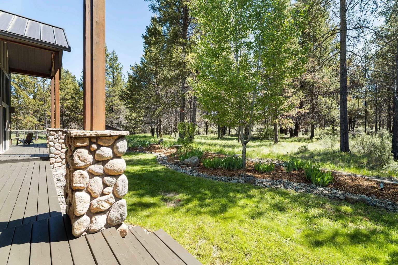 Striking stone column finishes and soaring overhead entryways create a dramatic and welcoming first impression.