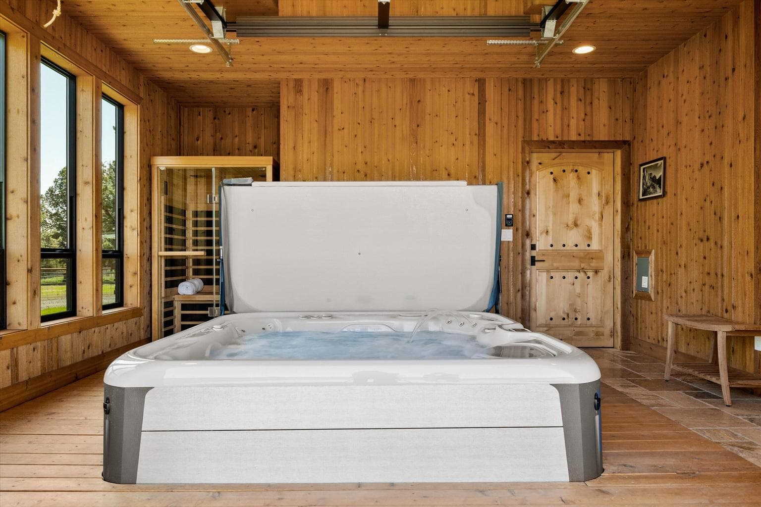 Indoor hot tub room with sauna