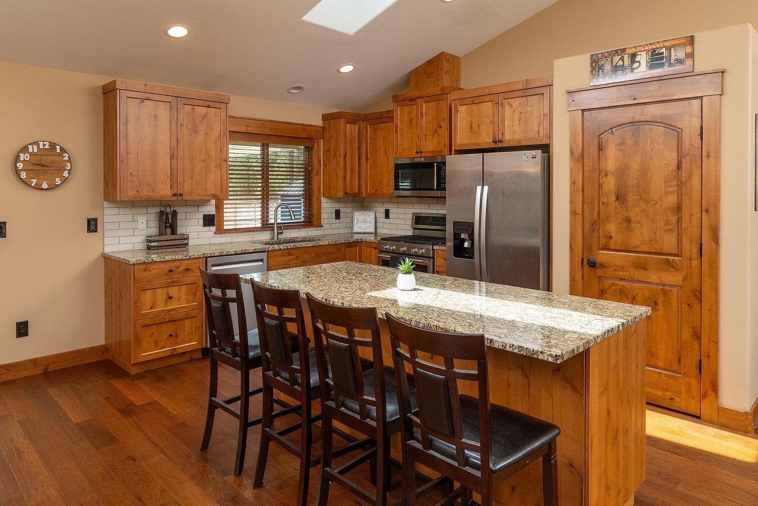 Solid wood doors, large kitchen island with breakfast seating!