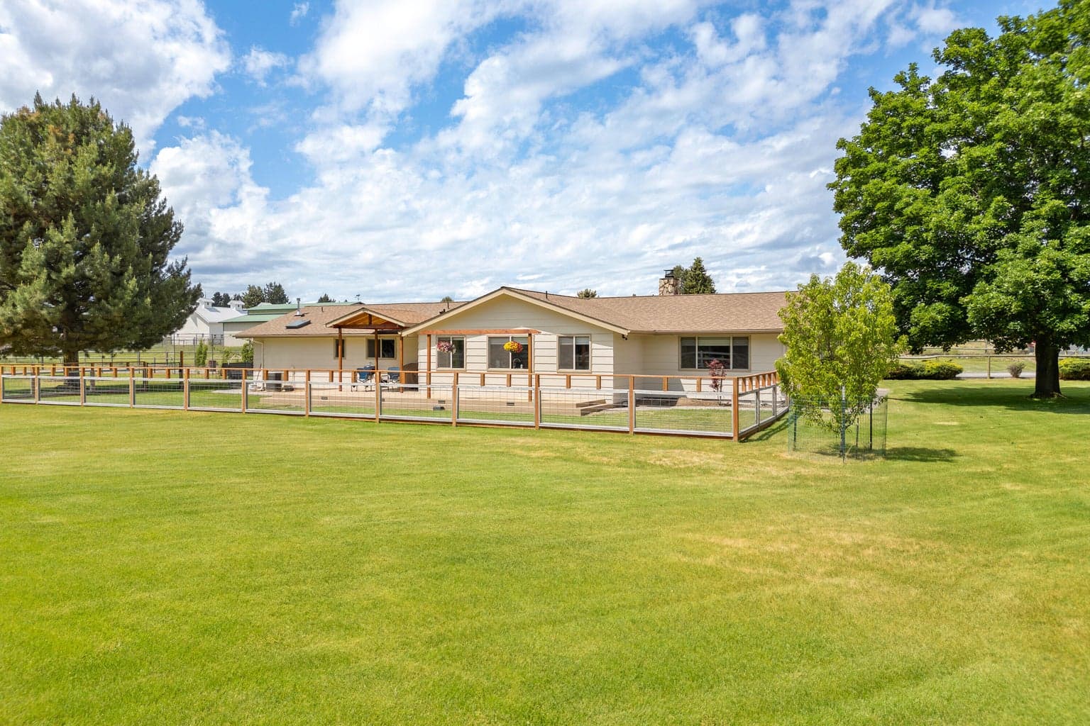 Smaller fenced yard directly off the house for pets